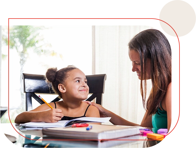 Girl and woman doing homework together.